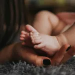 Can AI hold a baby?